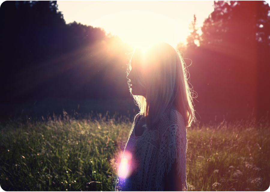 Goddess Glow Vitamin D Gummies 12 Woman standing in nature with natural sunlight representing natural sources of Vitamin D